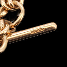 Load image into Gallery viewer, A close-up of a rose gold Tbar stamped with a maker's mark