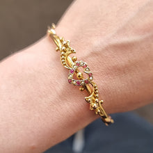 Load image into Gallery viewer, Antique 9ct Gold Ruby and Seed Pearl Heart Bangle modelled