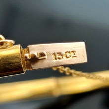 Load image into Gallery viewer, Close-up of a yellow gold bangle clasp stamped 15CT