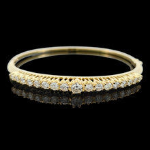 Load image into Gallery viewer, A yellow gold diamond bangle bracelet, on a black background