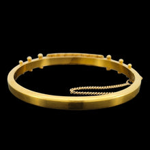 Load image into Gallery viewer, A yellow gold Etruscan style bangle bracelet set with emeralds and diamonds