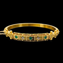 Load image into Gallery viewer, A yellow gold Etruscan style bangle bracelet set with emeralds and diamonds