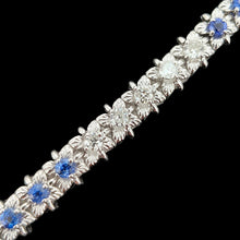 Load image into Gallery viewer, A sapphire and diamond white gold line bracelet, on a black background