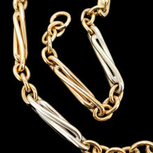 Load image into Gallery viewer, A yellow and white gold link bracelet, on a black background