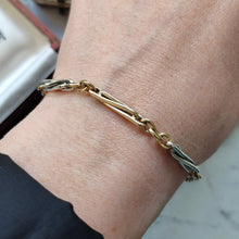 Load image into Gallery viewer, A yellow and white gold link bracelet, modelled on a wrist