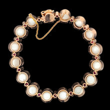 Load image into Gallery viewer, A pearl and ruby bracelet in rose gold, on a black background