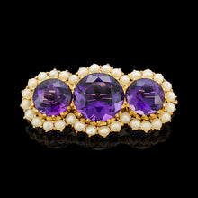 Load image into Gallery viewer, A yellow gold pearl and amethyst brooch, on a black background
