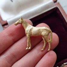 Load image into Gallery viewer, Victorian 9ct Yellow Gold Horse Brooch held in the hand