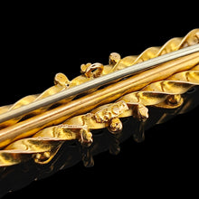 Load image into Gallery viewer, A close-up of a 15CT stamp on the back of a yellow gold bar brooch, on a black background