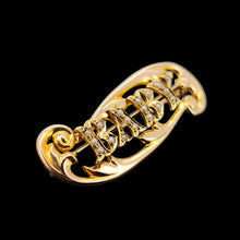 Load image into Gallery viewer, A yellow gold brooch with the word BABY written in pearls, on a black background