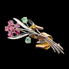 Load image into Gallery viewer, A ruby and green zircon flower bouquet brooch in white and rose gold, on a black background