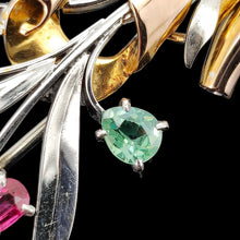 Load image into Gallery viewer, Close-up of a ruby and green zircon flower bouquet brooch in white and rose gold, on a black background