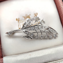 Load image into Gallery viewer, A white gold lily of the valley floral brooch set with diamonds, sitting in an antique box