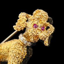 Load image into Gallery viewer, A yellow gold poodle dog brooch with ruby eyes and a diamond set collar, on a black background