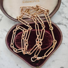 Load image into Gallery viewer, A gold trombone link chain necklace with a lobster claw clasp, in an antique box