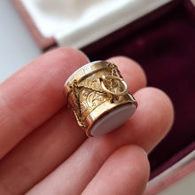 Load image into Gallery viewer, Antique Rolled Gold Agate Drum Charm in hand