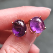 Load image into Gallery viewer, 9ct Gold Cabochon Amethyst Stud Earrings in hand