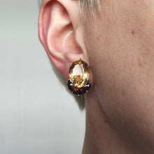 Load image into Gallery viewer, An oval citrine and marquise garnet earring in yellow gold, modelled in an ear