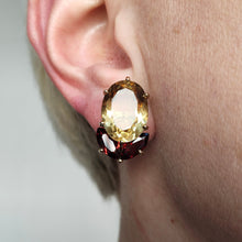 Load image into Gallery viewer, An oval citrine and marquise garnet earring in yellow gold, modelled in an ear