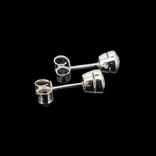 Load image into Gallery viewer, Pair of platinum stud earrings on a black background