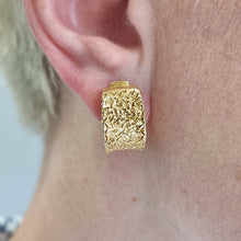 Load image into Gallery viewer, Nicolis Cola 18ct Yellow Gold Textured Half Hoop Earrings modelled in the ear