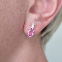Load image into Gallery viewer, Pink sapphire and diamond earring worn on an ear with a blurred background