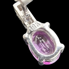 Load image into Gallery viewer, Close-up of a white gold earring with pink sapphire and diamonds, showing the 18k stamp, on a black background