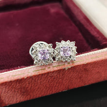 Load image into Gallery viewer, A pair of pink sapphire and diamond cluster stud earrings in white gold in an antique box