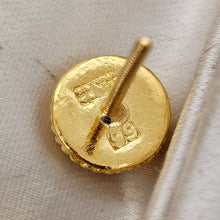 Load image into Gallery viewer, Close-up of a yellow gold stud earring with a 99 stamp
