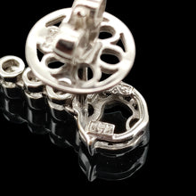 Load image into Gallery viewer, Close-up of a 750 stamp on a white gold earring back