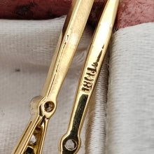 Load image into Gallery viewer, Close-up of 18CT stamp on the back of a yellow gold earring