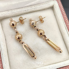 Load image into Gallery viewer, A pair of engraved bead and bar drop earrings in yellow gold, in an antique box