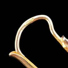 Load image into Gallery viewer, Close-up of a 750 stamp on a yellow gold earring fitting