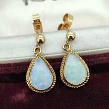 Load image into Gallery viewer, A pair of pear shaped opal drop earrings in yellow gold, in an antique box