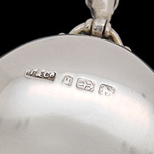 Load image into Gallery viewer, Close-up of a silver locket with visible hallmarks on a black background