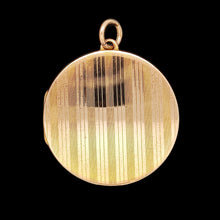Load image into Gallery viewer, A circular yellow gold locket with pinstripe engraving