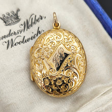 Load image into Gallery viewer, An intricately engraved oval locket in yellow gold, with a banner with monogrammed initials reading FP