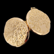 Load image into Gallery viewer, A circular yellow gold engraved locket pendant, on a black background
