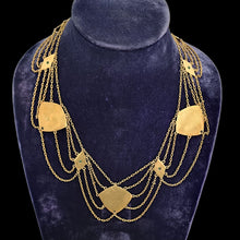 Load image into Gallery viewer, Gold necklace with pendants on a blue velvet stand