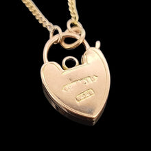 Load image into Gallery viewer, Gold heart-shaped padlock pendant on a chain against a black background