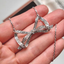 Load image into Gallery viewer, Vintage 18ct White Gold Diamond Bow Necklace in hand