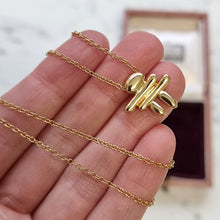 Load image into Gallery viewer, Birks "Inukshuk" 18k Yellow Gold Pendant Necklace in hand