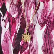 Load image into Gallery viewer, Antique 15ct Gold Pearl Star Pendant with 14ct Gold Curb Chain modelled against a pink blouse