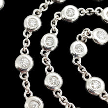Load image into Gallery viewer, A white gold round diamond station necklace, close-up