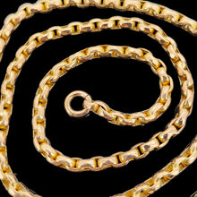 Load image into Gallery viewer, A yellow gold faceted link chain necklace, on a black background