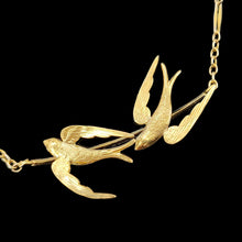 Load image into Gallery viewer, A yellow gold pendant necklace featuring two swallow birds in flight