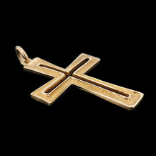 Load image into Gallery viewer, A yellow gold cutout design cross pendant, on a black background