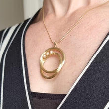 Load image into Gallery viewer, Vintage 14k Gold Pearl Double Circle Pendant modelled with chain