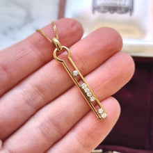 Load image into Gallery viewer, Vintage 18ct Yellow Gold Diamond Keyhole Pendant in hand, with chain