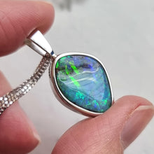 Load image into Gallery viewer, 18ct White Gold Boulder Opal Pendant in hand
